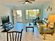 Living room with tile floors and patio access at 2311 Brisbane St # 65, Clearwater, FL 33763