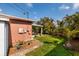 Backyard with patio cover and tropical landscaping at 2351 Leslee Lake N Dr, St Petersburg, FL 33713