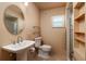Clean bathroom with pedestal sink and shower at 2351 Leslee Lake N Dr, St Petersburg, FL 33713