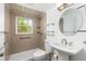Updated bathroom with walk-in shower and glass enclosure at 2351 Leslee Lake N Dr, St Petersburg, FL 33713