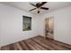 Bright bedroom with wood-look floors and ceiling fan at 2351 Leslee Lake N Dr, St Petersburg, FL 33713