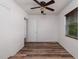 Simple bedroom with wood-look floors and neutral walls ready for customization at 2351 Leslee Lake N Dr, St Petersburg, FL 33713