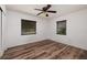 Spacious bedroom with wood-look floors and dual windows at 2351 Leslee Lake N Dr, St Petersburg, FL 33713