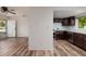 Modern kitchen with dark wood cabinets, stainless steel appliances, and ample counter space at 2351 Leslee Lake N Dr, St Petersburg, FL 33713