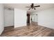 Spacious living area showcasing hardwood floors and an open floor plan leading to the kitchen at 2351 Leslee Lake N Dr, St Petersburg, FL 33713