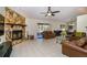 Living room with leather sofas and a stone fireplace at 23523 Shining Star Dr, Land O Lakes, FL 34639