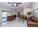 Spacious living room with leather sofas and tile floors at 23523 Shining Star Dr, Land O Lakes, FL 34639