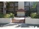 Spanish-style building with fountain and landscaping at 2400 Feather Sound Dr # 717, Clearwater, FL 33762