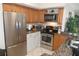 Modern kitchen with stainless steel appliances at 2400 Feather Sound Dr # 717, Clearwater, FL 33762