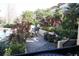Community pool with patio furniture and grill at 2400 Feather Sound Dr # 717, Clearwater, FL 33762