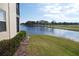 Serene waterfront view from condo, featuring a peaceful lake at 2400 Feather Sound Dr # 717, Clearwater, FL 33762