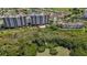 Aerial view highlighting the condo complex, a lush landscape, and views of the water at 2825 Terra Ceia Bay Blvd # 1504, Palmetto, FL 34221
