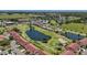 Aerial shot overlooking a condo community with lush golf course, serene ponds, and manicured landscapes at 2825 Terra Ceia Bay Blvd # 1504, Palmetto, FL 34221