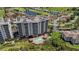 Beautiful aerial showcasing the condo's balconies and swimming pool, surrounded by lush greenery at 2825 Terra Ceia Bay Blvd # 1504, Palmetto, FL 34221