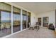 Screened balcony with seating area and panoramic views of the water at 2825 Terra Ceia Bay Blvd # 1504, Palmetto, FL 34221