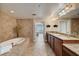 Open bathroom with tub, granite countertops, double sinks, and neutral tile work at 2825 Terra Ceia Bay Blvd # 1504, Palmetto, FL 34221