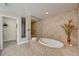 Bathroom features a tub with jets, neutral tile work, and a glass enclosed shower at 2825 Terra Ceia Bay Blvd # 1504, Palmetto, FL 34221