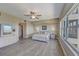 Large bedroom with wood floors, ceiling fan, and big windows overlooking the waterfront at 2825 Terra Ceia Bay Blvd # 1504, Palmetto, FL 34221