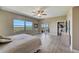 Beautiful bright bedroom with water views, light wood floors, and sliding door to the balcony at 2825 Terra Ceia Bay Blvd # 1504, Palmetto, FL 34221