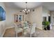 Elegant dining room features a glass table, chandelier, and tiled flooring at 2825 Terra Ceia Bay Blvd # 1504, Palmetto, FL 34221