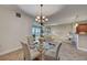 This dining area features a glass table with seating, opening up to a cozy living room space at 2825 Terra Ceia Bay Blvd # 1504, Palmetto, FL 34221