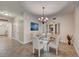 Bright dining room featuring tile floors, a glass table with seating for four, and a decorative chandelier at 2825 Terra Ceia Bay Blvd # 1504, Palmetto, FL 34221