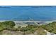 Picturesque view of a long pier extending into the tranquil waters, surrounded by lush greenery at 2825 Terra Ceia Bay Blvd # 1504, Palmetto, FL 34221