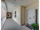 Inviting condo hallway leading to unit 150 with charming decor and outdoor views at 2825 Terra Ceia Bay Blvd # 1504, Palmetto, FL 34221