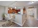 Kitchen with stainless steel appliances, granite countertops, and a breakfast bar with white chairs at 2825 Terra Ceia Bay Blvd # 1504, Palmetto, FL 34221