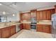 A kitchen featuring stainless steel appliances, wood cabinets, and granite countertops at 2825 Terra Ceia Bay Blvd # 1504, Palmetto, FL 34221