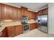 This kitchen boasts stainless steel appliances, wood cabinets, and granite countertops at 2825 Terra Ceia Bay Blvd # 1504, Palmetto, FL 34221