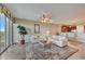 Bright living room boasts tile floors, ceiling fan, and access to a private balcony at 2825 Terra Ceia Bay Blvd # 1504, Palmetto, FL 34221