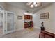 Cozy office featuring built-in cabinets, laminate floors, and a ceiling fan at 2825 Terra Ceia Bay Blvd # 1504, Palmetto, FL 34221