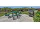 Outdoor grill and picnic table with lush green space in a community recreation area at 2825 Terra Ceia Bay Blvd # 1504, Palmetto, FL 34221