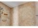 Neutral tiled shower with installed grab bars, shower head, and soap dish at 2825 Terra Ceia Bay Blvd # 1504, Palmetto, FL 34221
