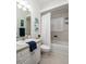 Bathroom with shower/tub combo, white vanity, and window at 351 46Th N Ave, St Petersburg, FL 33703