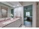 Double vanity bathroom with granite countertop and view of bedroom at 351 46Th N Ave, St Petersburg, FL 33703