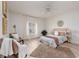 Bright bedroom with light flooring, a ceiling fan, and a large window at 351 46Th N Ave, St Petersburg, FL 33703