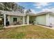House exterior with a covered patio and lawn at 351 46Th N Ave, St Petersburg, FL 33703