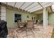 Covered patio with table and chairs at 351 46Th N Ave, St Petersburg, FL 33703