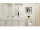 Bright bathroom with double vanity, toilet and shower at 5190 Meyer Bessie St, Zephyrhills, FL 33541
