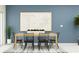 Modern dining room with six chairs and a large piece of art at 5190 Meyer Bessie St, Zephyrhills, FL 33541