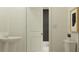 Clean bathroom with pedestal sink, toilet, and modern decor at 5210 Meyer Bessie St, Zephyrhills, FL 33541
