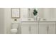 Clean bathroom with double vanity and modern fixtures at 5210 Meyer Bessie St, Zephyrhills, FL 33541