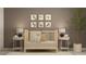 Bedroom with crib, nightstands and animal wall art at 5210 Meyer Bessie St, Zephyrhills, FL 33541