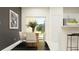 Dining room with wooden table, chairs, and modern art at 5210 Meyer Bessie St, Zephyrhills, FL 33541