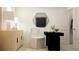 Modern home office with light wood cabinets and black desk at 5210 Meyer Bessie St, Zephyrhills, FL 33541