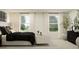 Spacious main bedroom with plush bedding and large windows at 5210 Meyer Bessie St, Zephyrhills, FL 33541