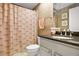 Clean bathroom with granite countertop and decorative shower curtain at 5340 Cobblestone Ct, Wesley Chapel, FL 33543