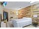 Cozy bedroom featuring a wood-paneled accent wall and a queen bed at 5340 Cobblestone Ct, Wesley Chapel, FL 33543